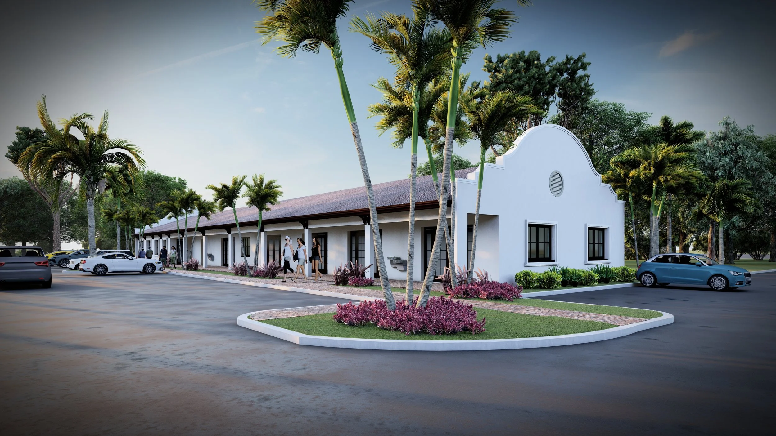 A modern building with white walls and a red-tiled roof, surrounded by palm trees and landscaping. There are cars parked around and people walking in front.