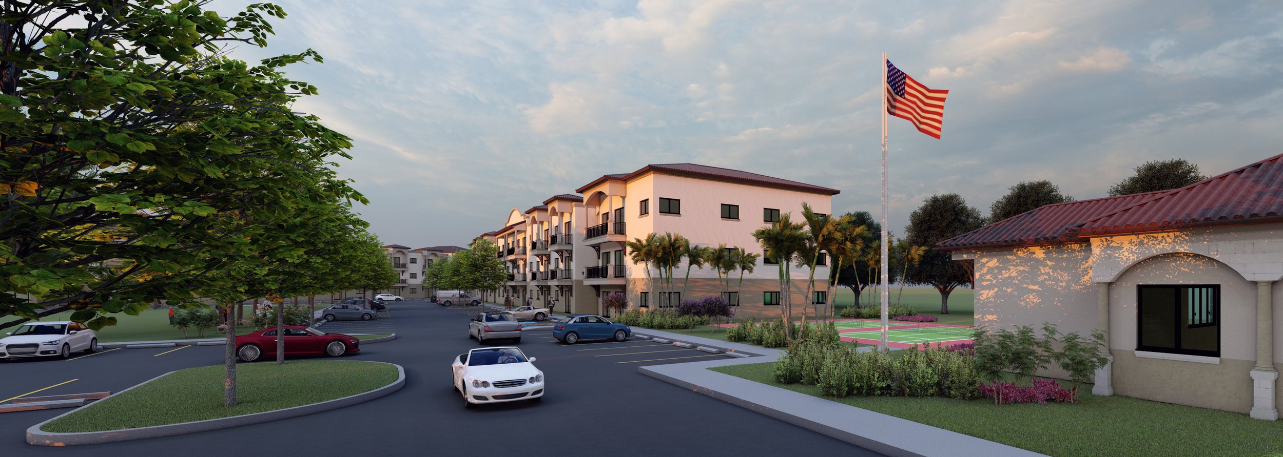 A residential complex with multiple white apartment buildings, a parking lot filled with cars, and an American flag flying on a flagpole, surrounded by green trees and landscaping.