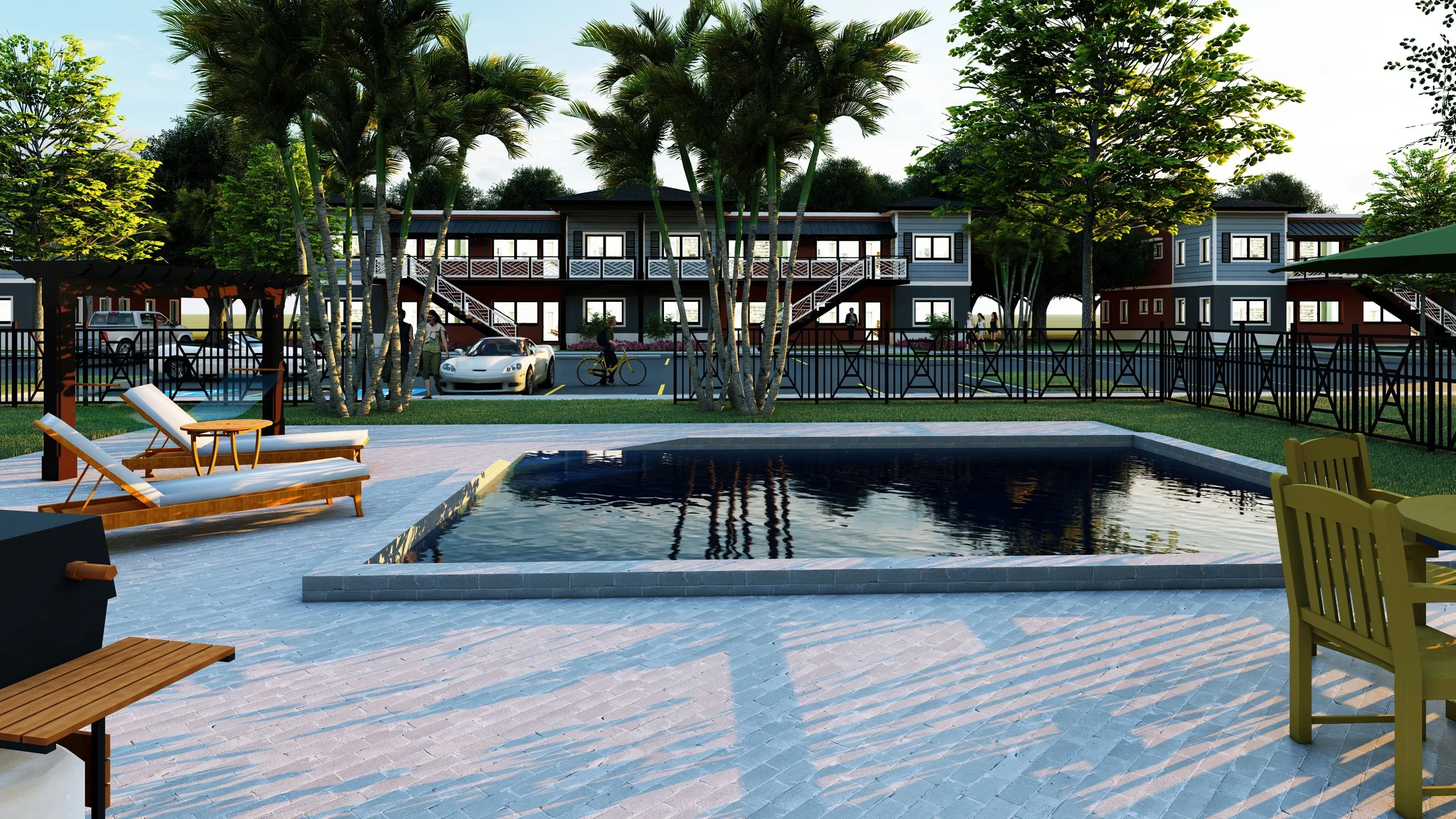 A modern apartment complex with a courtyard and swimming pool, surrounded by trees, with lounge chairs and outdoor furniture in the foreground.