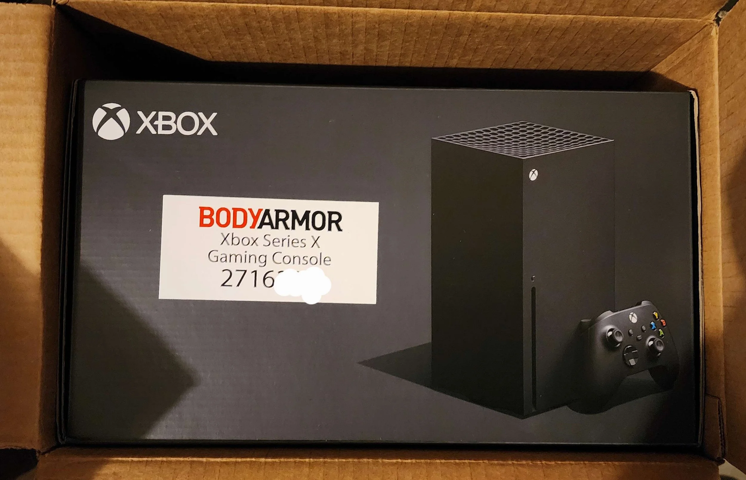 Box containing an Xbox Series X gaming console and controller, with branding and product information visible on the front.