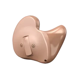 Close-up of a pink hearing aid.