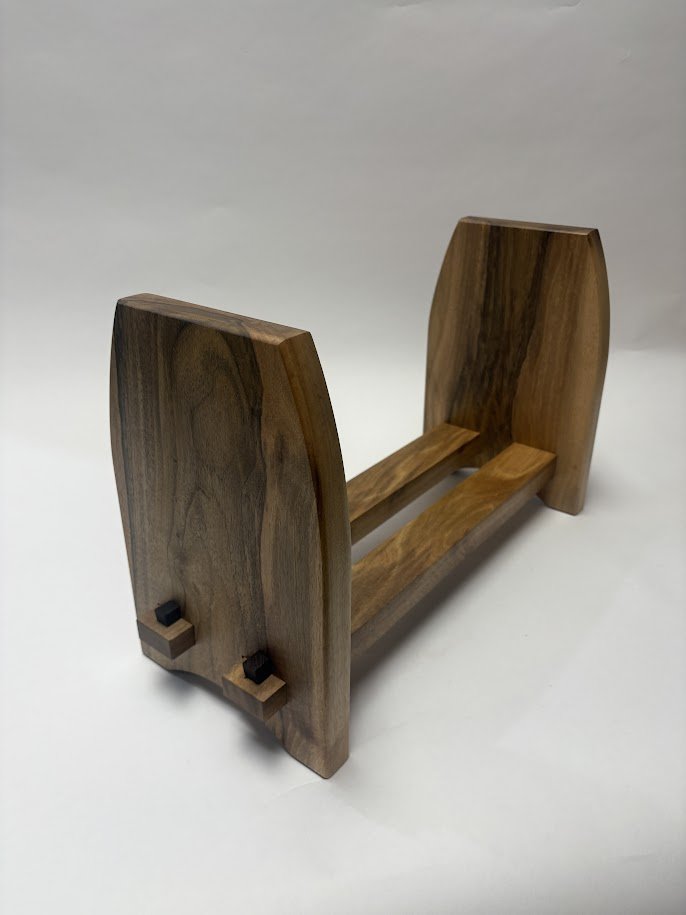 A wooden Desktop Bookshelf with two vertical sides and a horizontal base