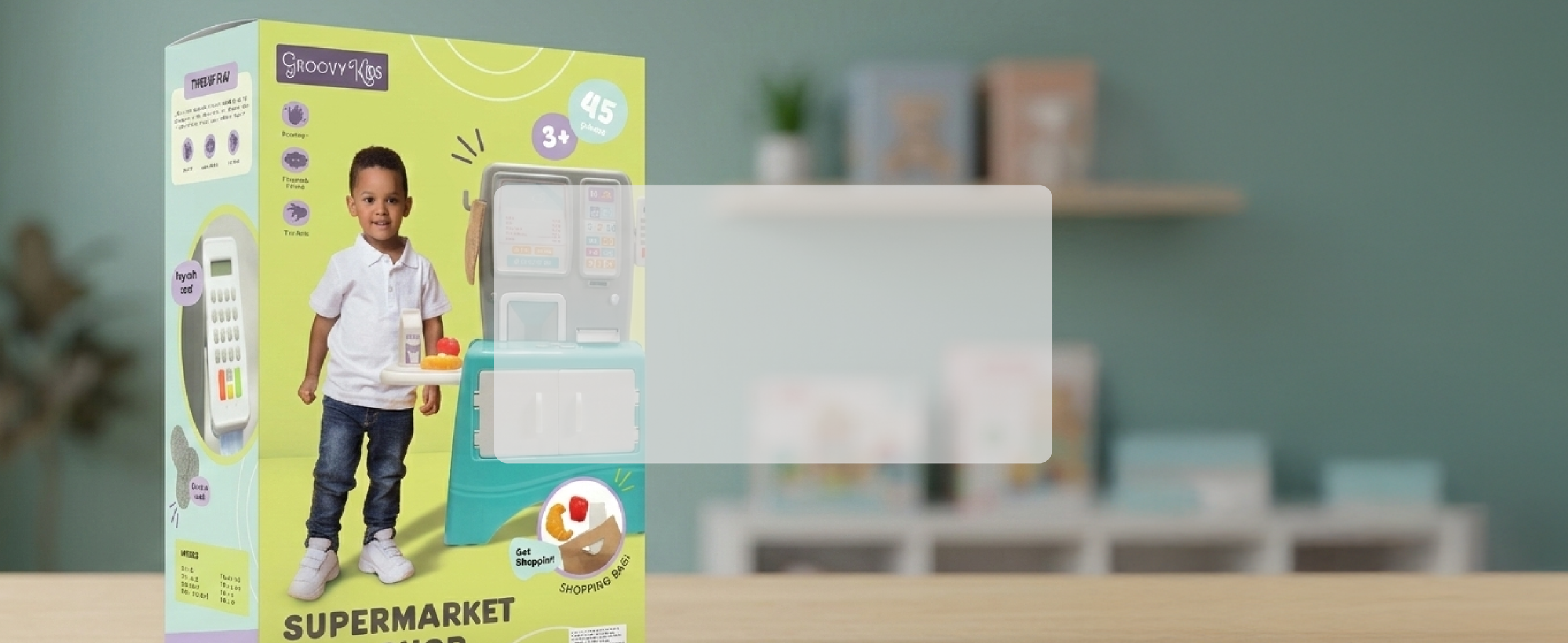 Toy pretend supermarket set featuring a little boy with food items and a pretend cash register, displayed on a table with a blurred background.