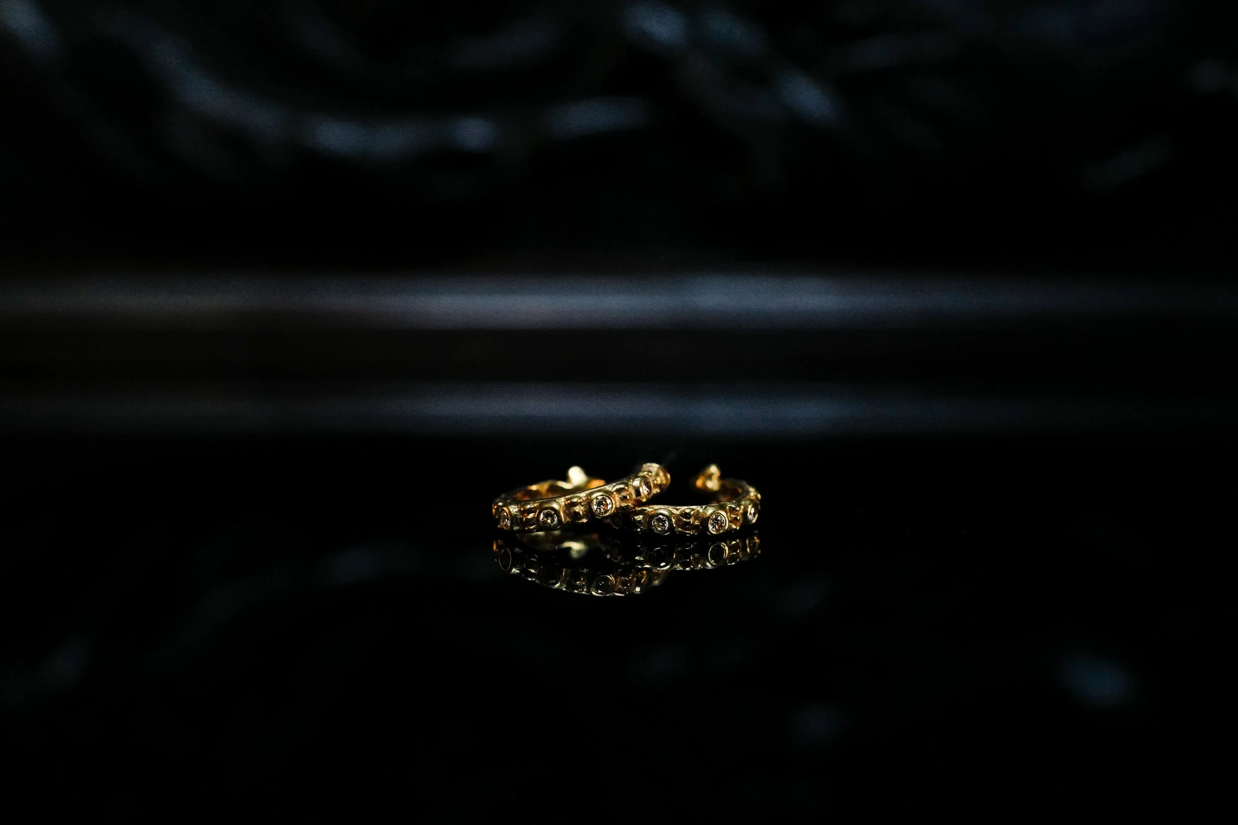 Diamond Snake Hoops lying flat on side.jpg
