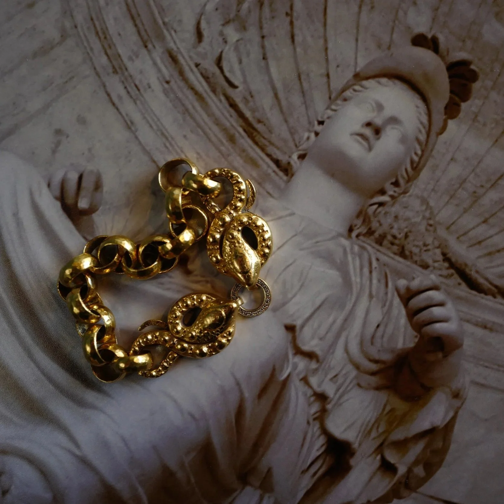 Snake+Bracelet+over+Statue+Photograph.jpg