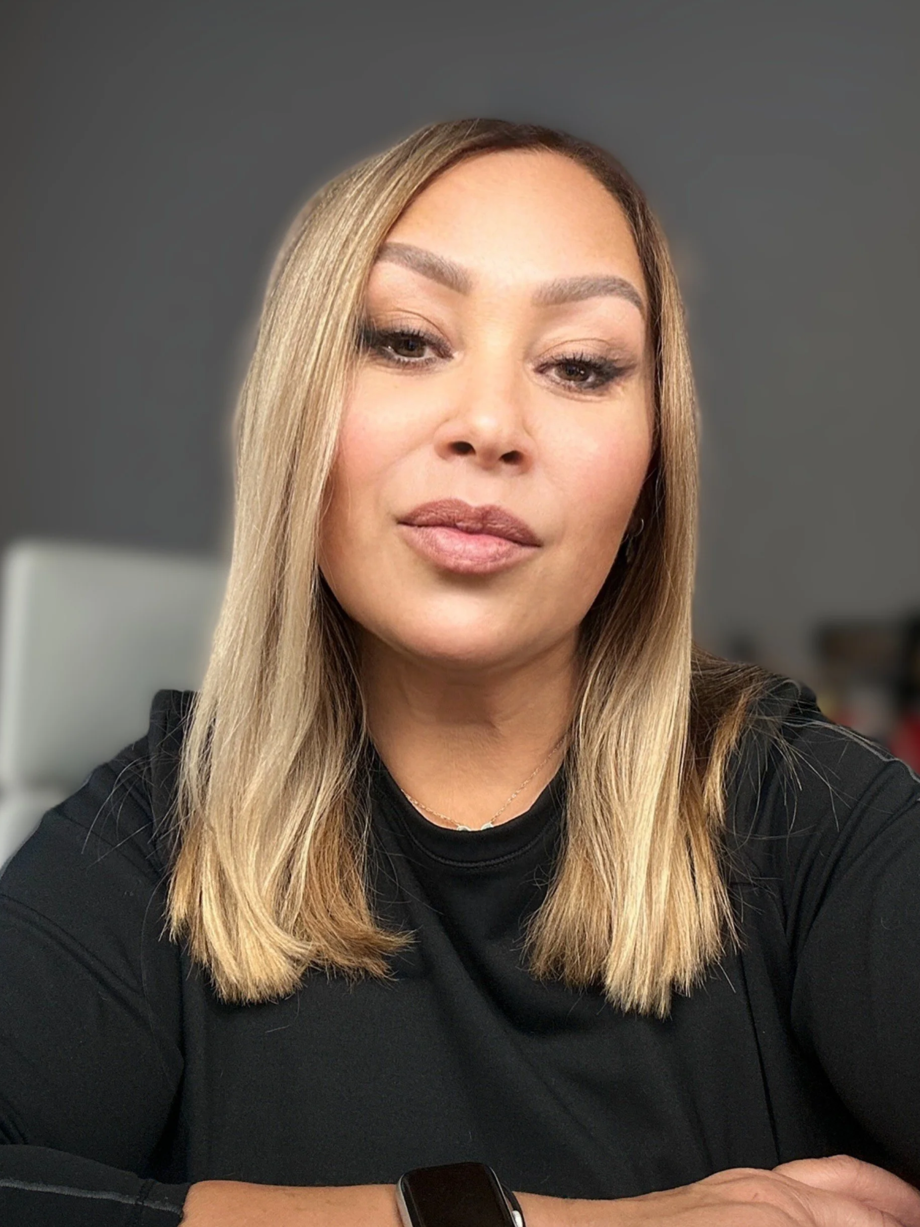Youlia Apostolova, woman-owned real estate broker and property manager in Summerville, SC, seated in her office, confident and approachable