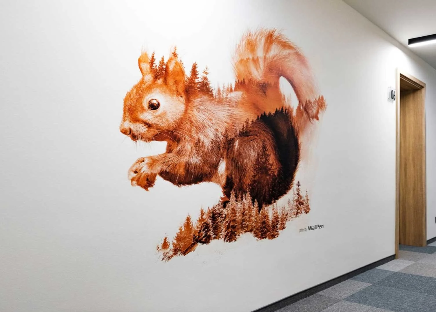 Wall mural of a squirrel with a forest scene inside its outline in an indoor setting.