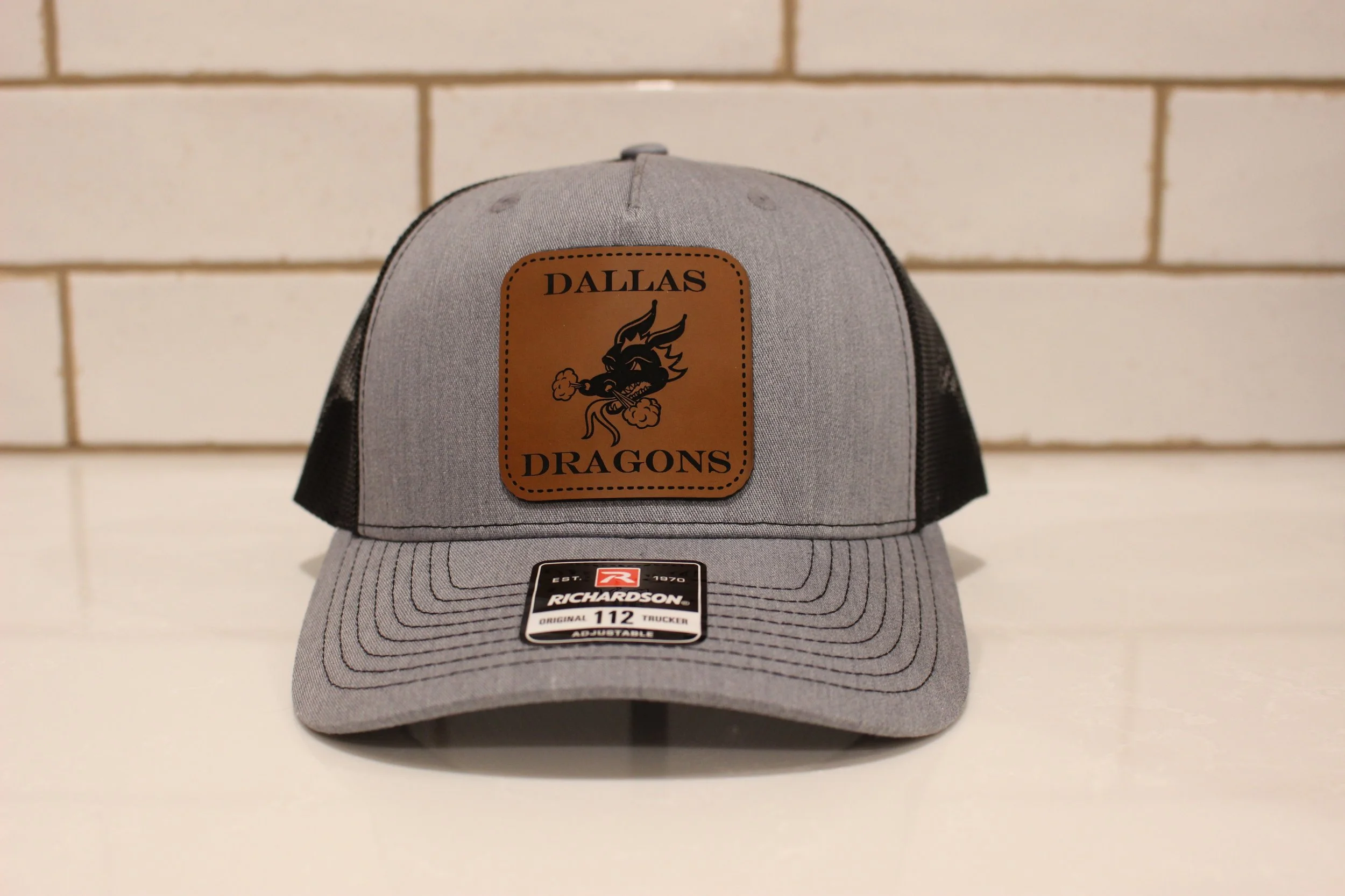 DALLAS DRAGONS TRUCKERS HAT WITH LEATHERETTE PATCH (Richardson 112)