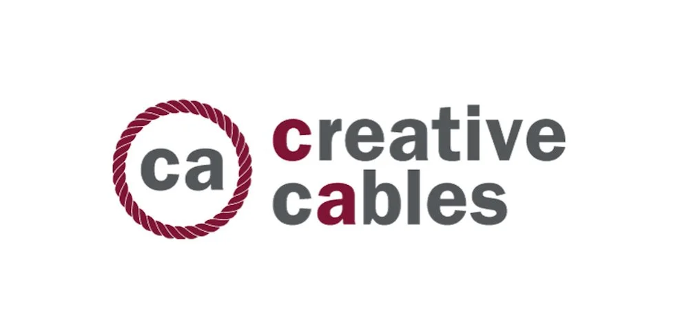 Logo for Creative Cables with a maroon circle made of rope around the letters 'ca', and the words 'creative cables' next to it, with 'creative' in gray and 'cables' in maroon.