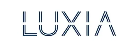 Luxia logo in blue outlined text against a white background.