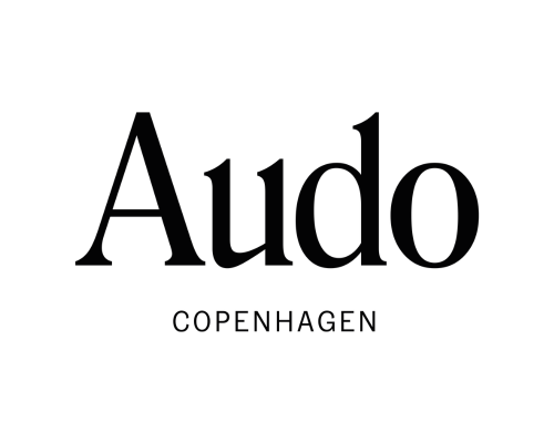 A logo with the word 'Audo' in large black font and 'Copenhagen' in smaller black font below it on a white background.