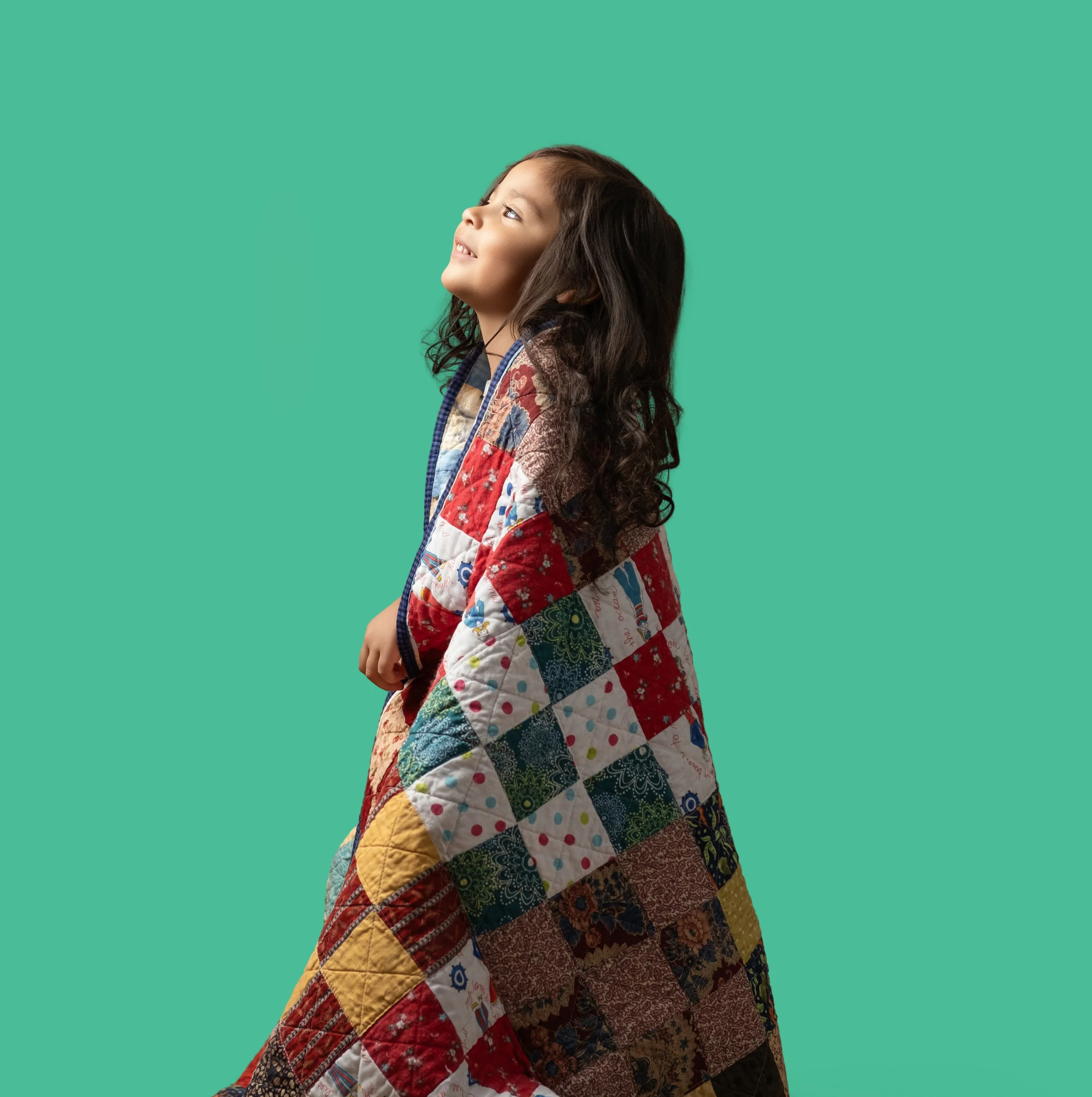 A girl wrapped in an EverHope quilt