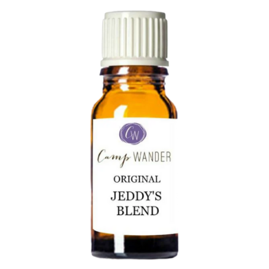 A small amber glass bottle with a white screw cap labeled 'Camp Wander Original Jeddy's Blend' with a purple logo at the top.