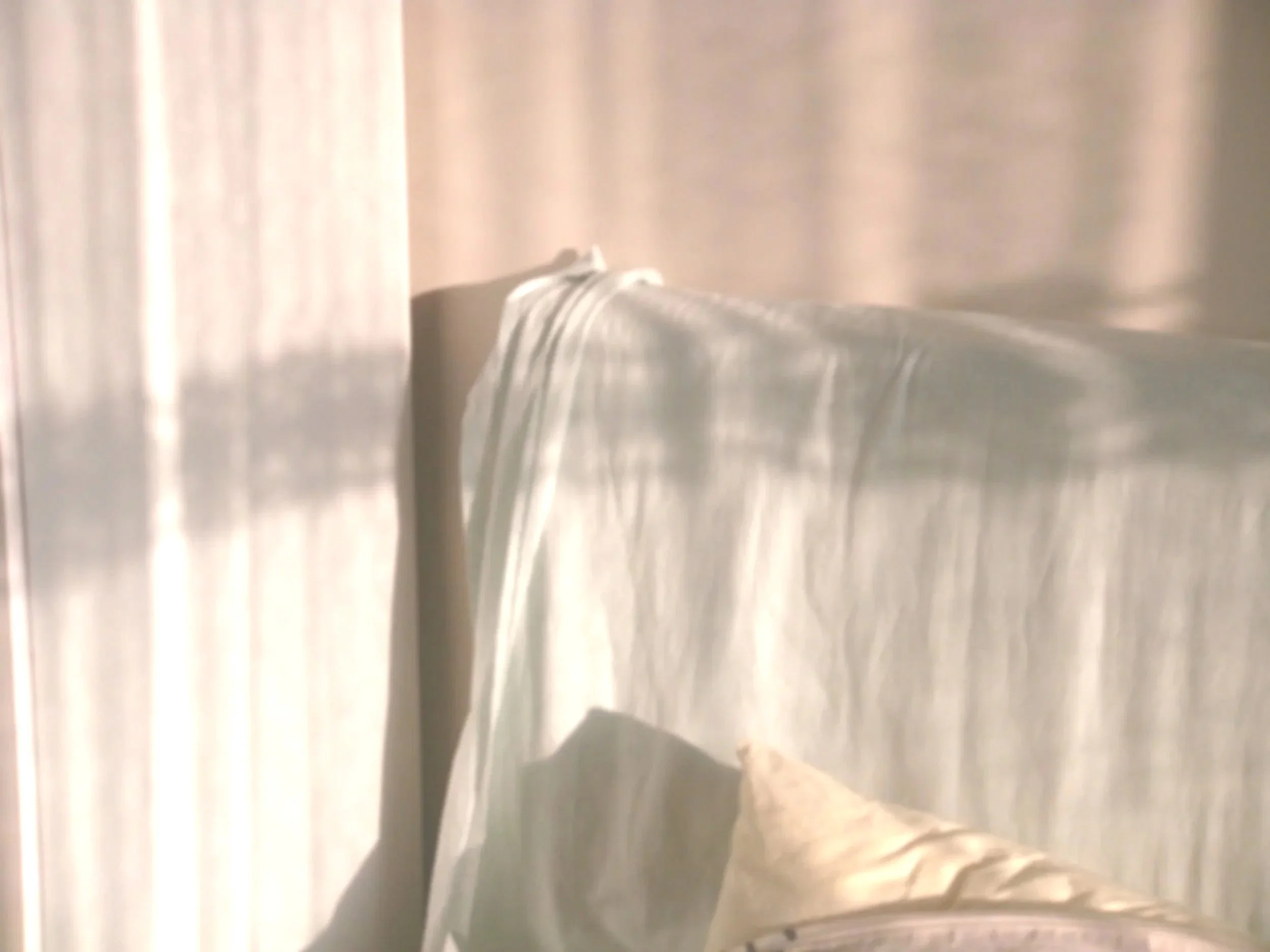 Close-up of a metallic surface with water droplets on it.