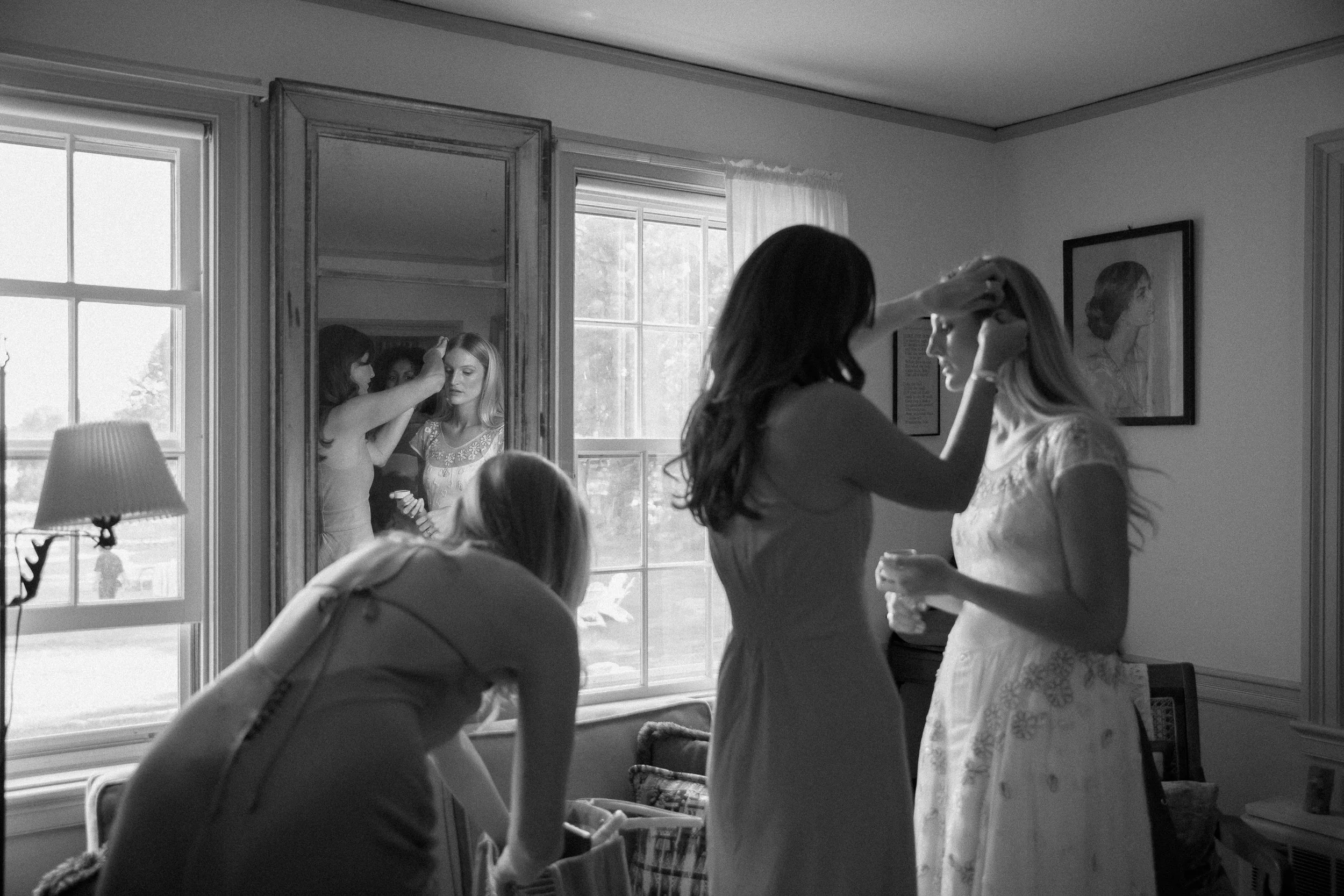 Romantic wedding getting-ready photography in Rhode Island, captured on a thoughtful blend of 35mm film and digital. Documenting the intimate moments before the ceremony, from bridal portraits and finishing touches to candid moments with loved ones. 