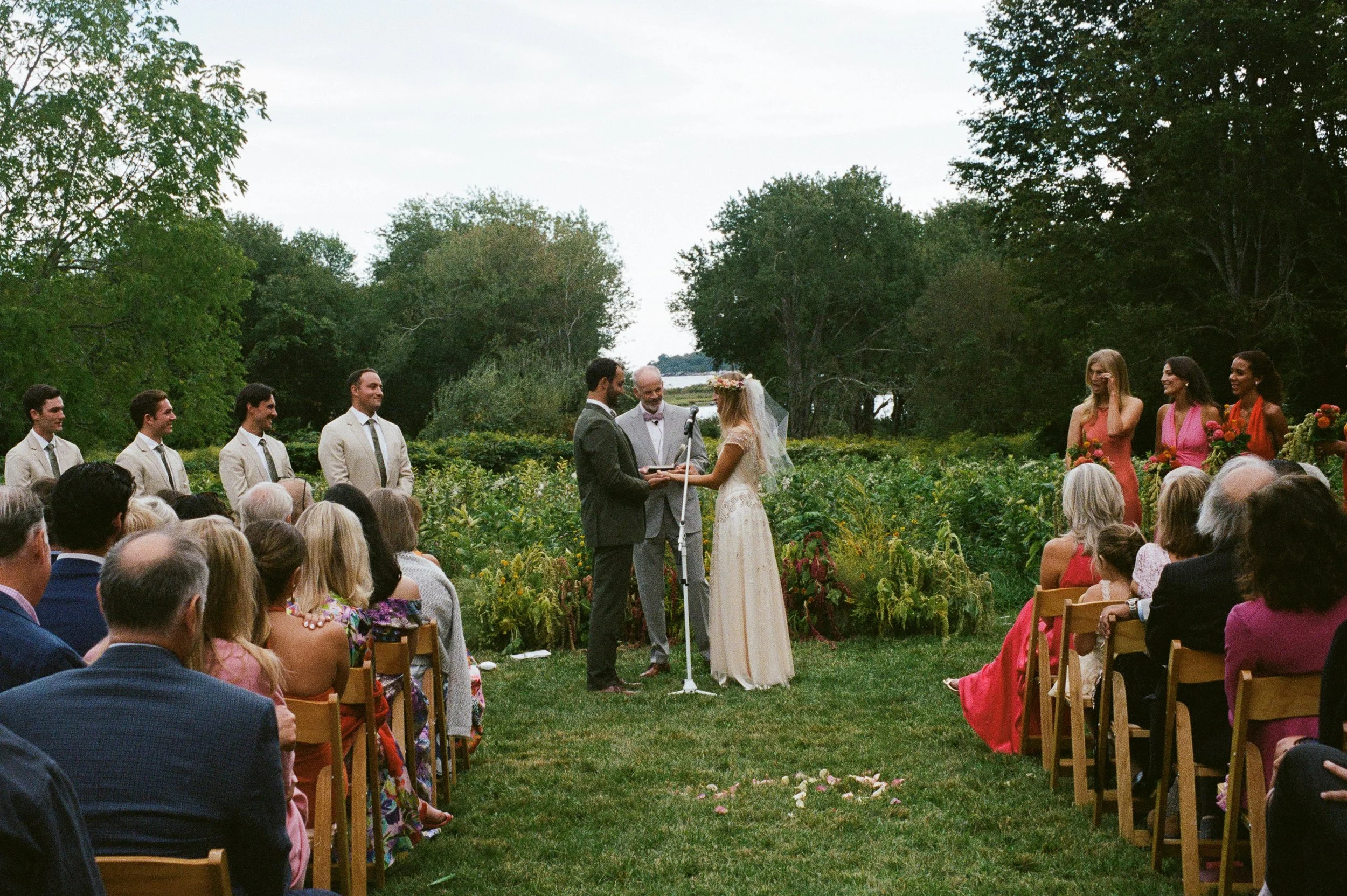 A timeless Rhode Island wedding photograph captured on 35mm film, preserving the genuine emotion, romantic details, and candid moments of the wedding day. Fine-art film wedding photography inspired by New England charm, natural light, and the nostalg