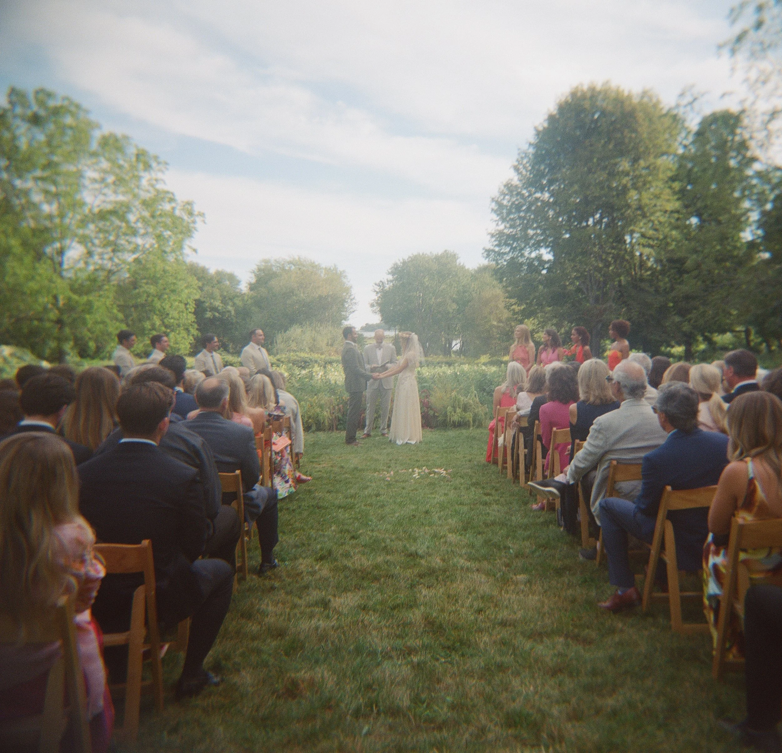 A timeless Rhode Island wedding photograph captured on 35mm film, preserving the genuine emotion, romantic details, and candid moments of the wedding day. Fine-art film wedding photography inspired by New England charm, natural light, and the nostalg