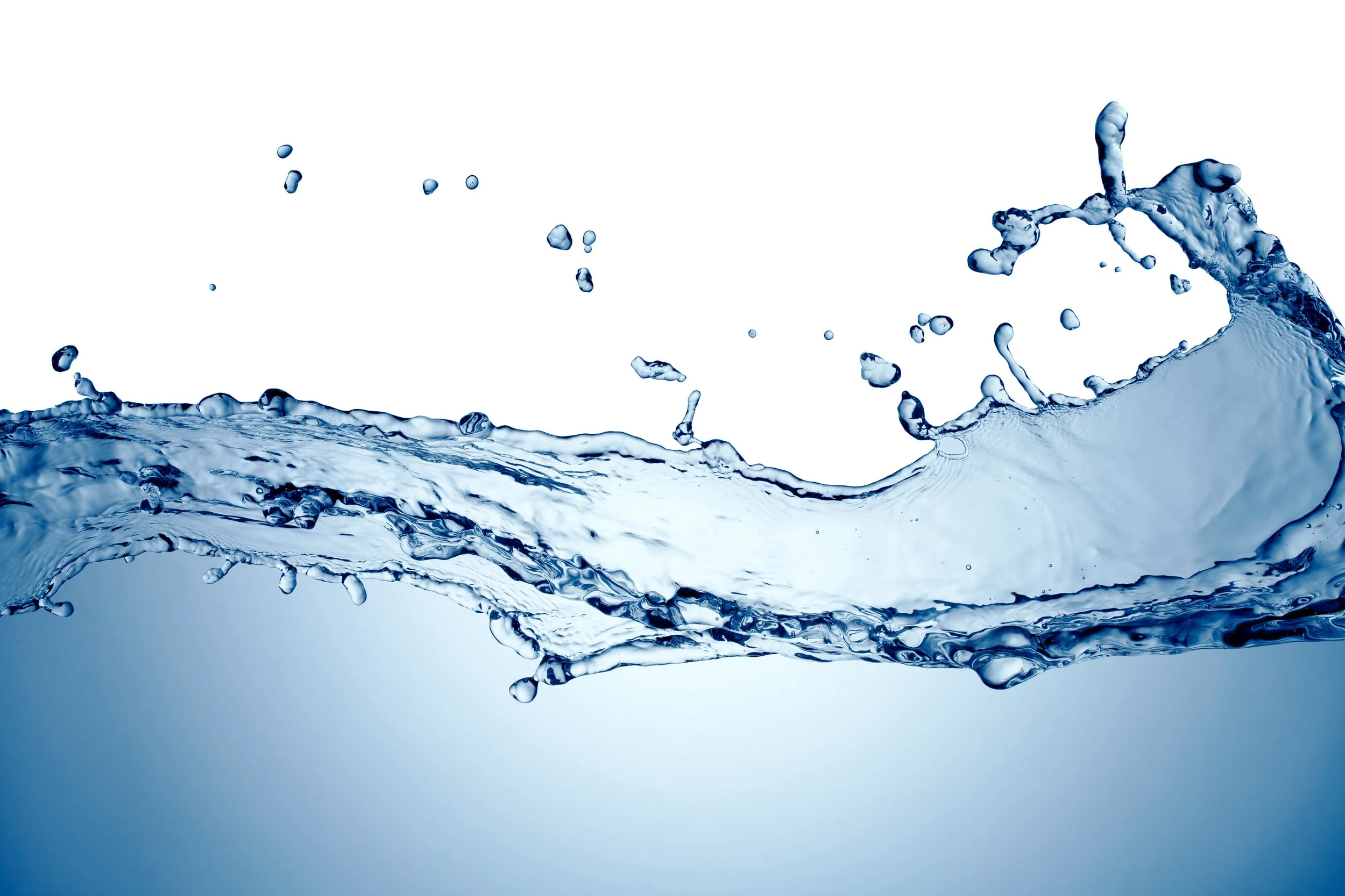 Splashes of water with droplets flying in the air on a white background.