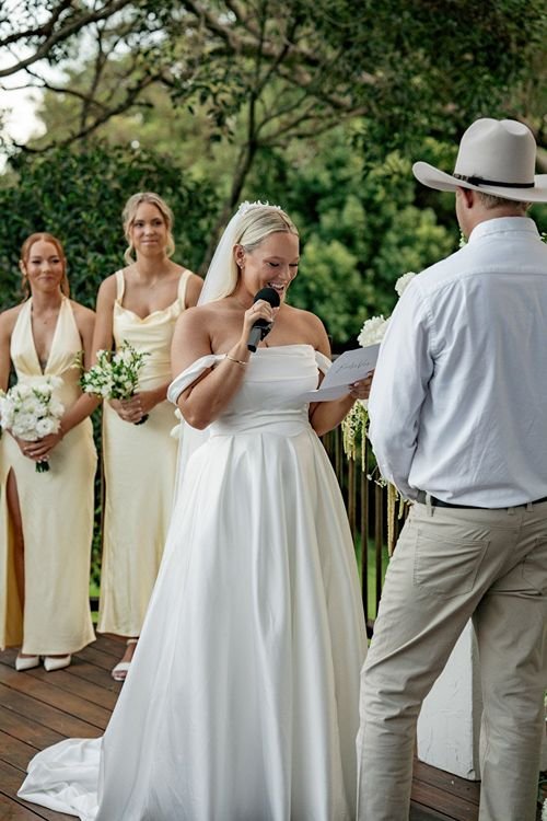 Bride reads vows to her to-be husband at the altar at Yandina Station