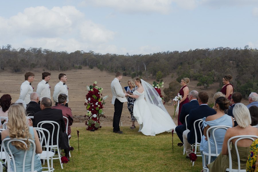 Outdoor wedding ceremony overlooking the Darling Downs at Bunnyconnellen wedding venue near Toowoomba.