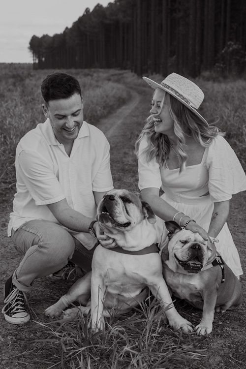 Eloped couple share moment together with their two happy English Bulldogs