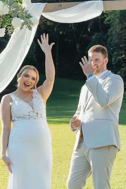 Excited couple shows their new rings off at wedding in Palm Beach
