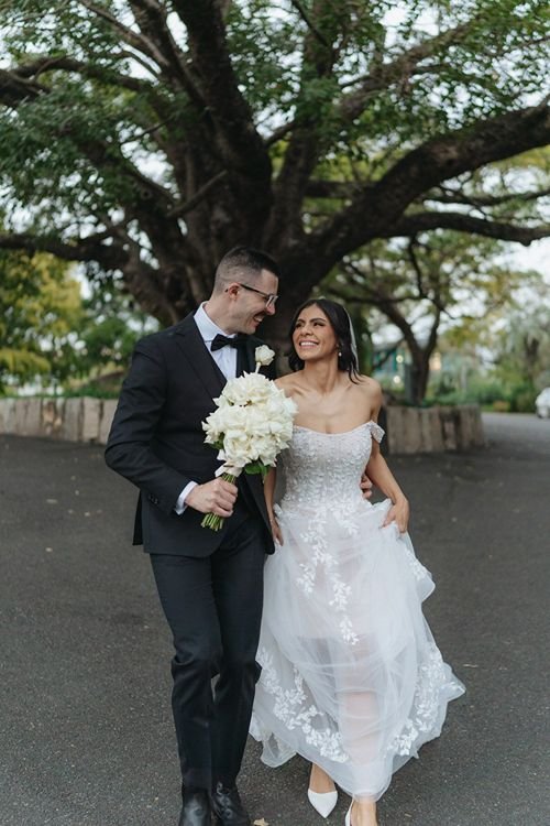 Couple walking through Brisbane City after eloping