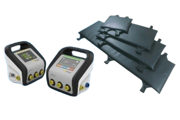 Two portable transcranial magnetic stimulation (TMS) devices and several black TMS coils.