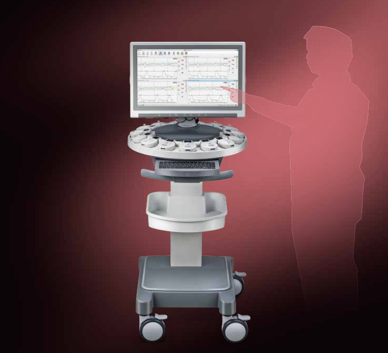 Medical ultrasound machine with a monitor displaying ECG readings, positioned on a mobile cart with a human silhouette pointing at the screen in a medical setting.