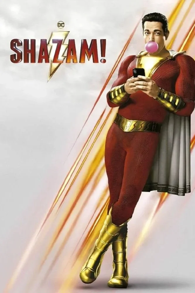 Poster of the movie Shazam! featuring a man dressed as a superhero with gold boots, a red costume, and a gray cape, holding a smartphone and blowing bubble gum.