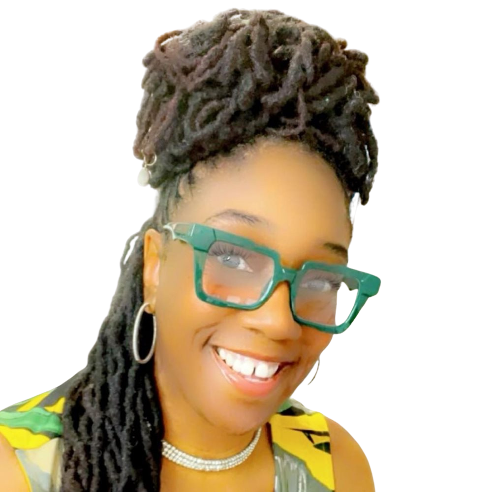 Close-up of smiling woman with styled dreadlocks wearing glasses, hoop earrings, and a yellow top, in an office with whiteboard and trophies in the background.