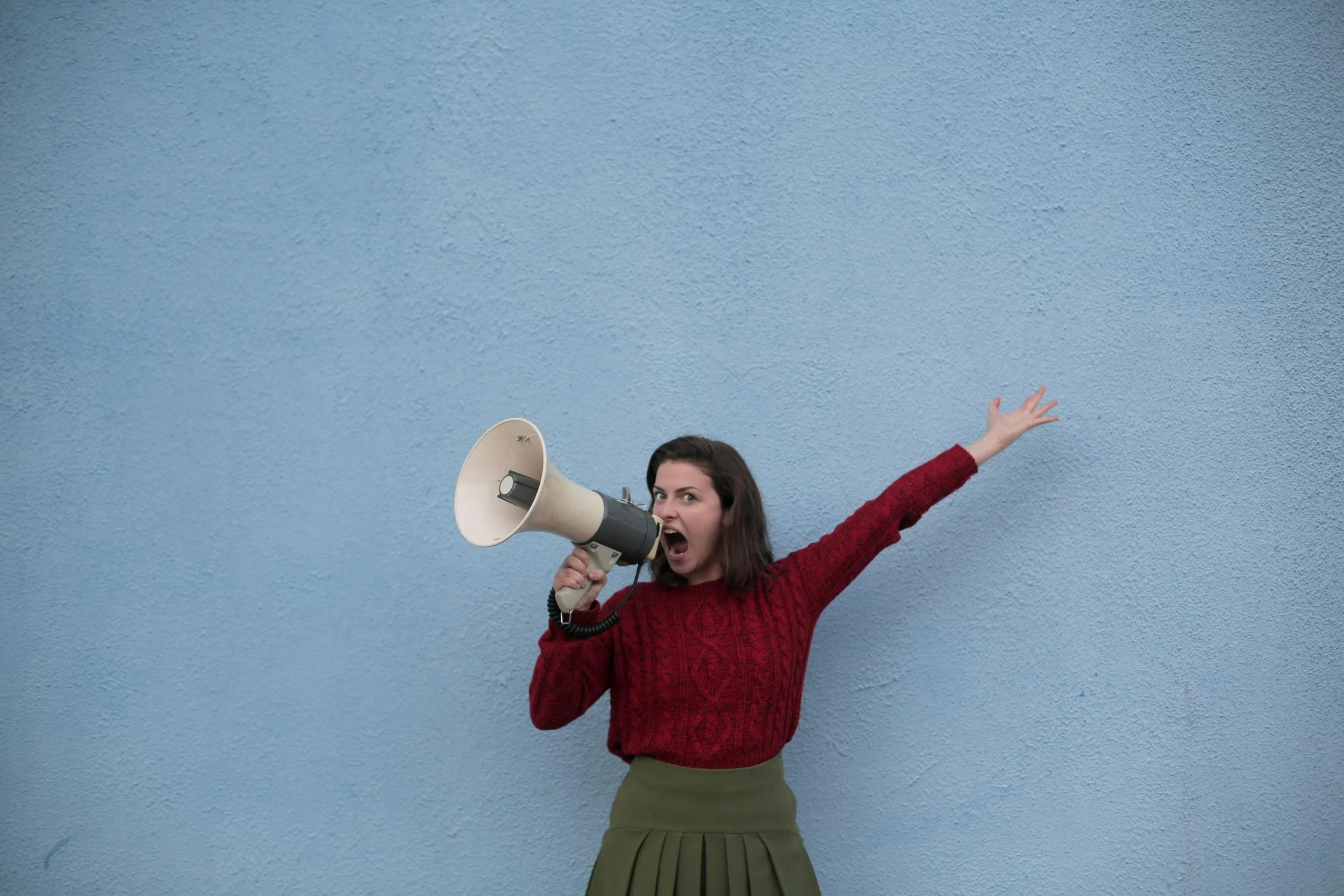 woman with bullhorn shouting