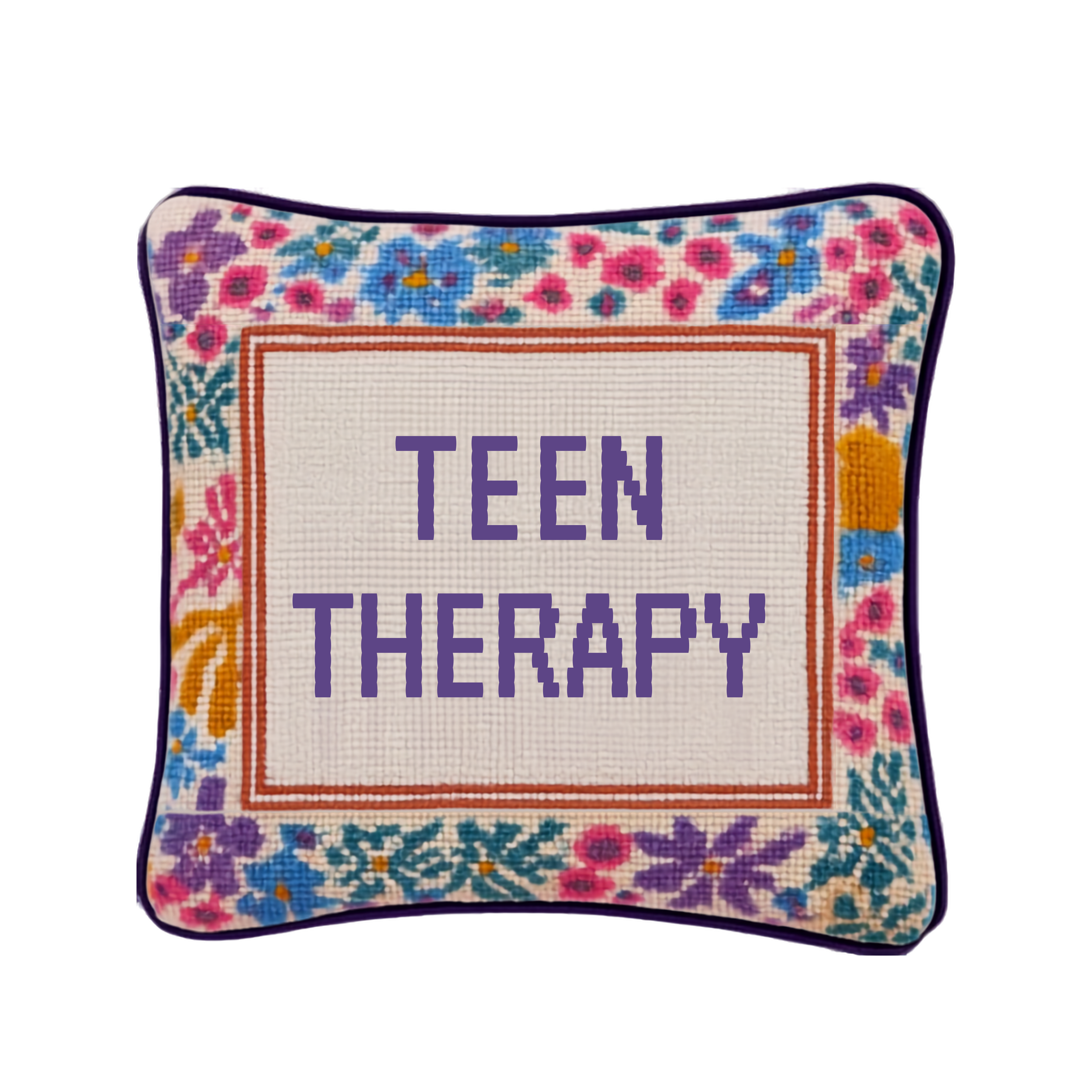 Colorful embroidered pillow with "TEEN THERAPY" stitched in purple letters, framed by a rainbow floral border — representing teen therapy at The Living Room Therapy + Wellness