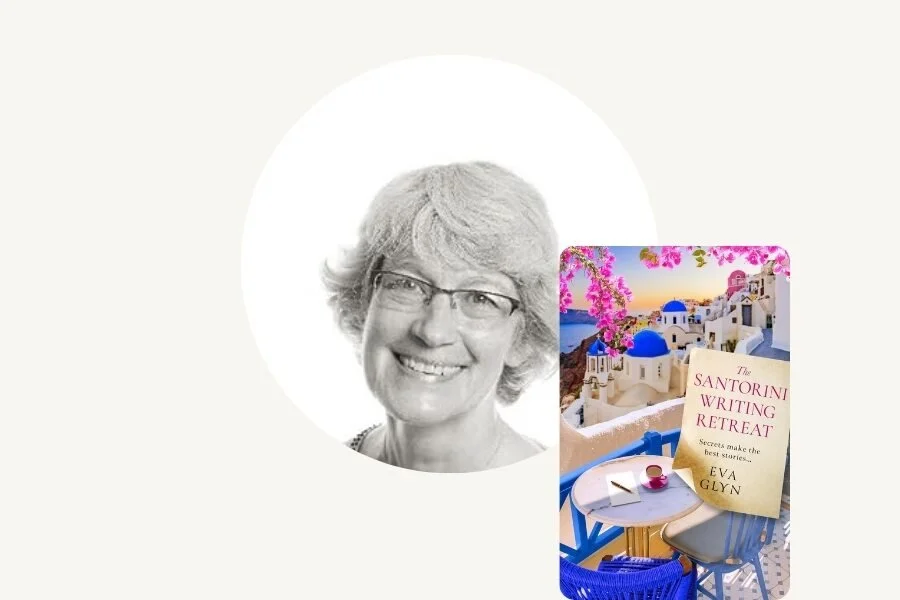 Black and white headshot of a smiling woman with glasses, against a white circular background, with a colorful postcard or brochure showing a scene from Santorini, Greece, with white buildings with blue domes, pink blossoms, and a small outdoor table and chair in the foreground.
