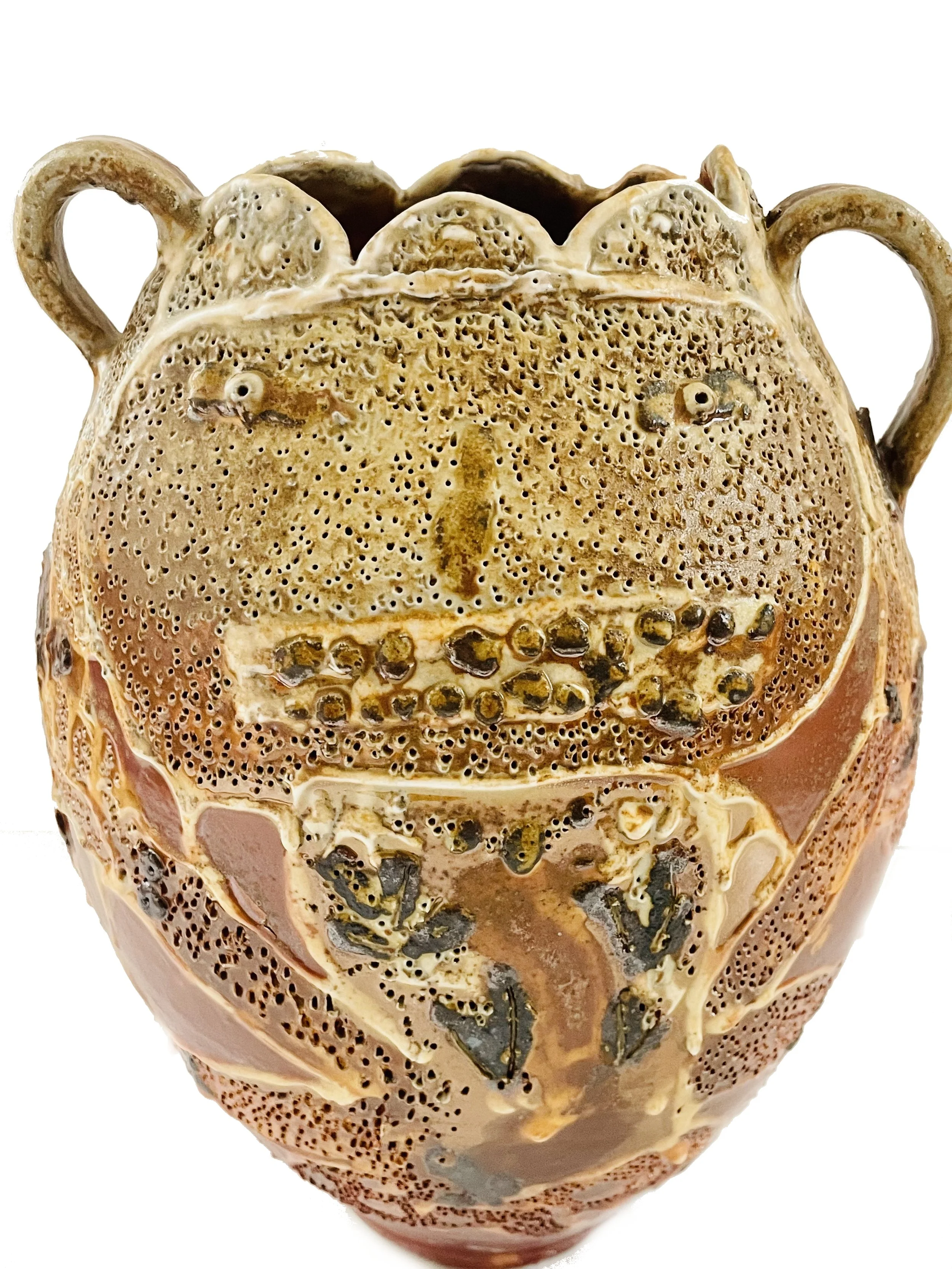 A decorative urn designed to resemble a human face, with textured surface, two handles, and intricate detailing.