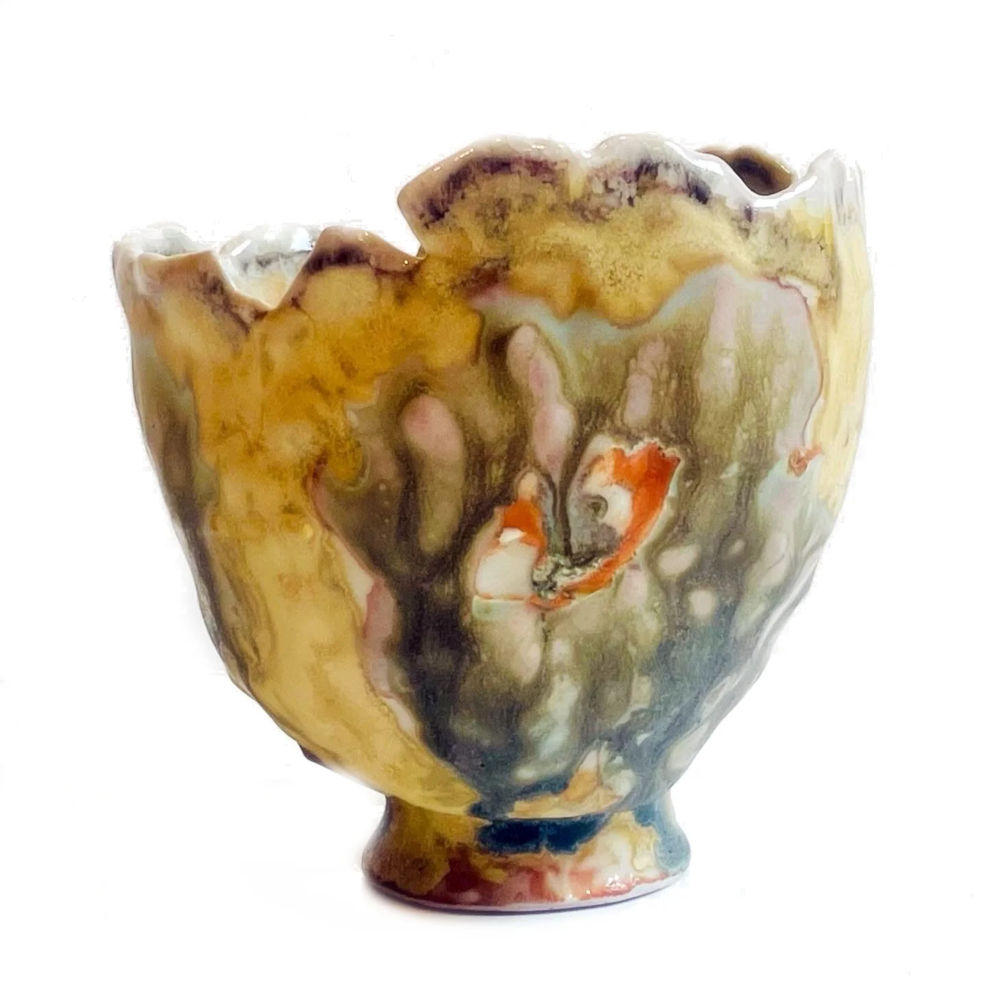 Abstract ceramic bowl with swirls of yellow, brown, white, black, and orange colors.