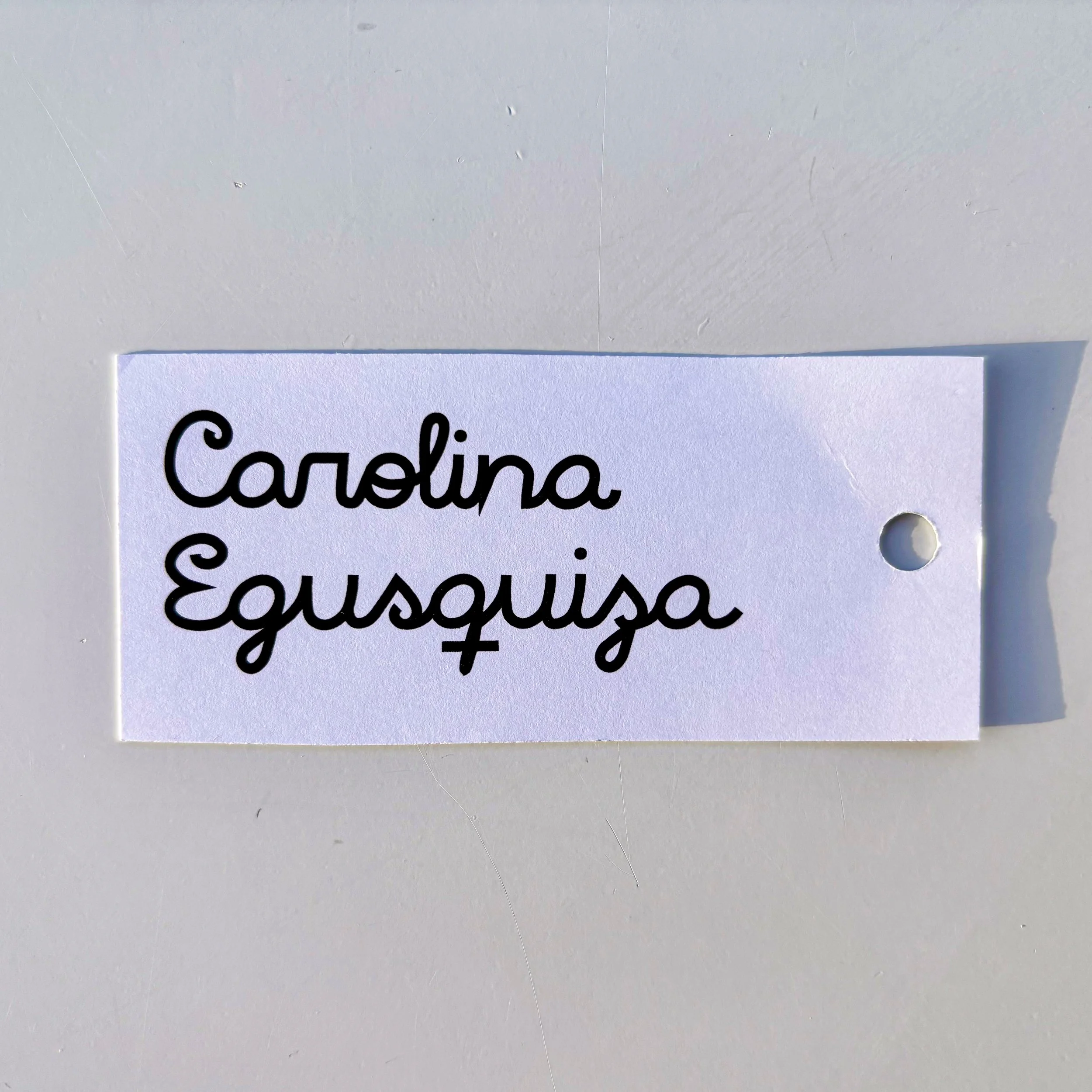 Image of a logo printed on cardstock. Sample print.