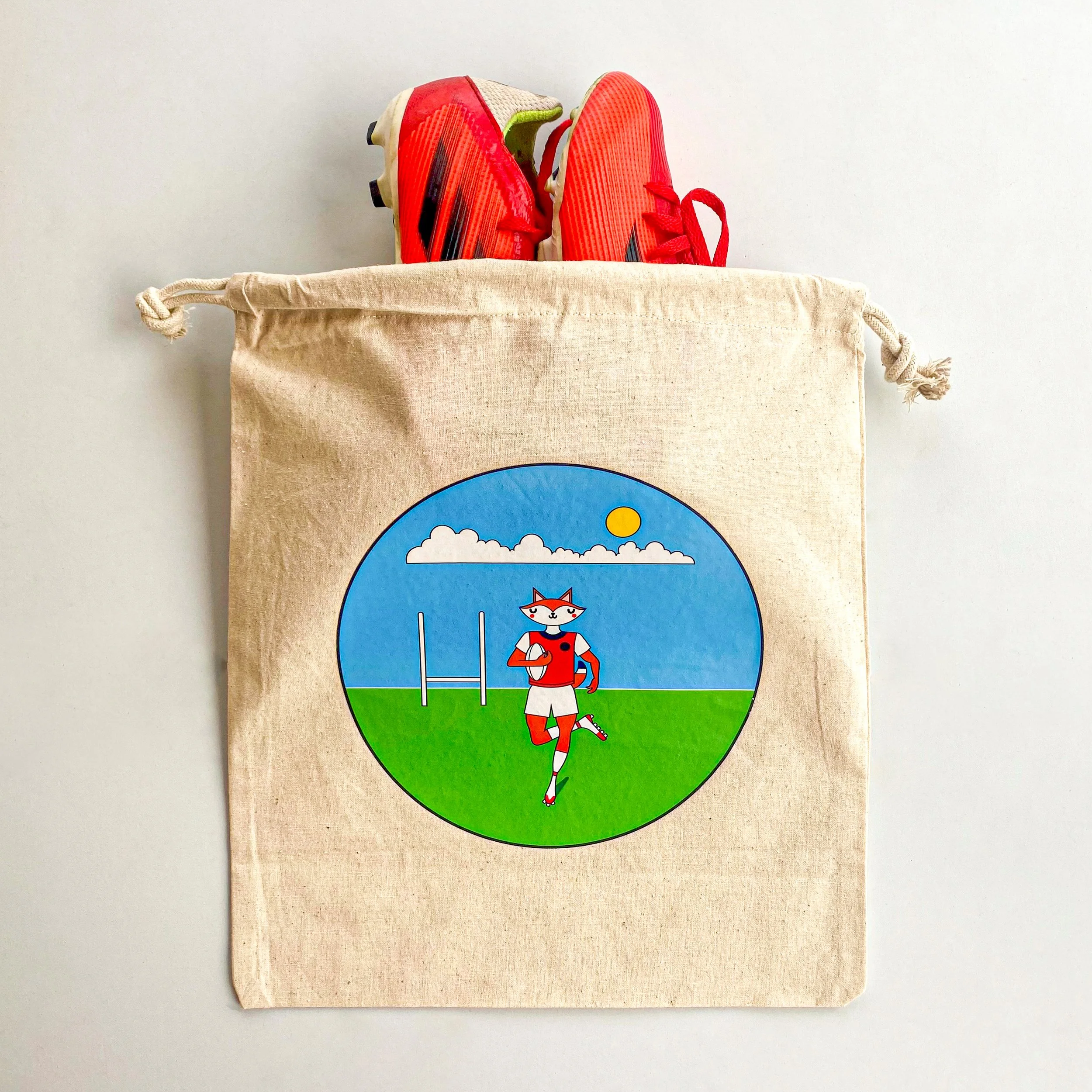 Photo of printed logo bag with a pair of shoes stacked into it.