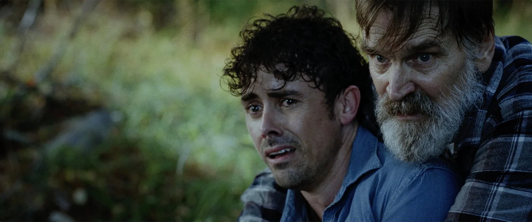 Julian Curtis and Bill Moseley react in horror during the forest scene in The Fetus.