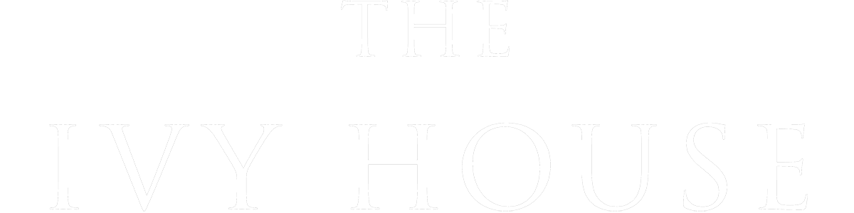 The cover of a book titled 'The Ivy House' in white text on a black background.