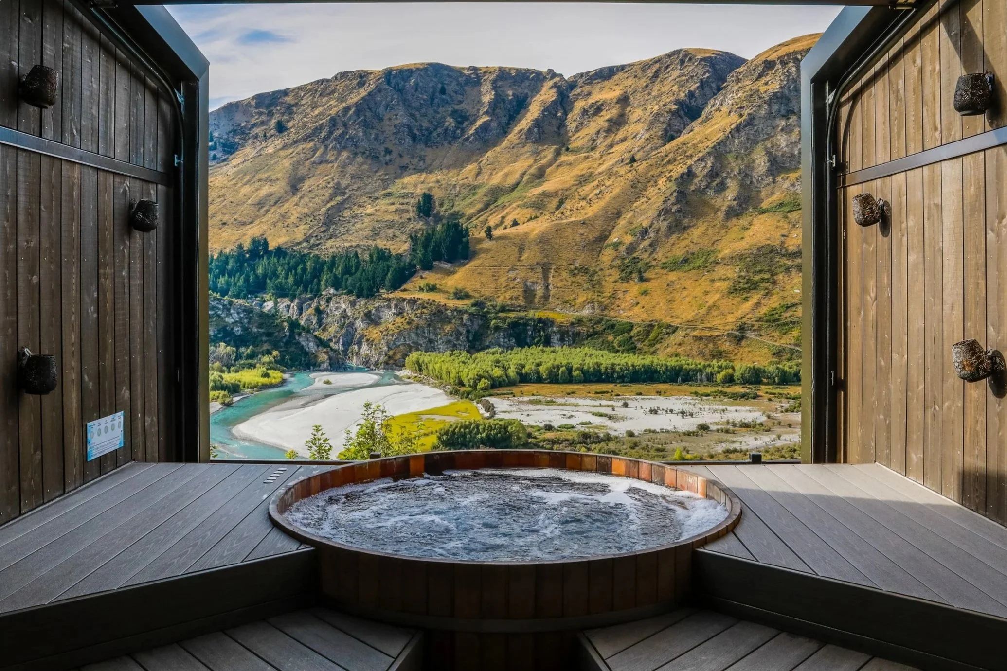 Landscape view of mountains behind onsen hot pools at a spa