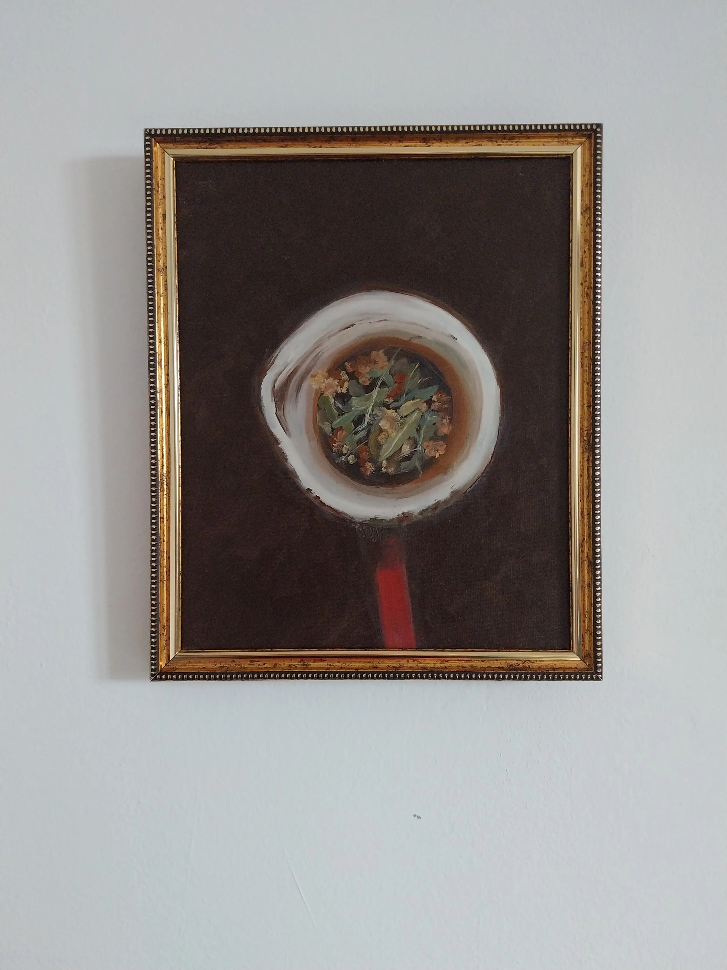 Red teapot on white wall.jpg