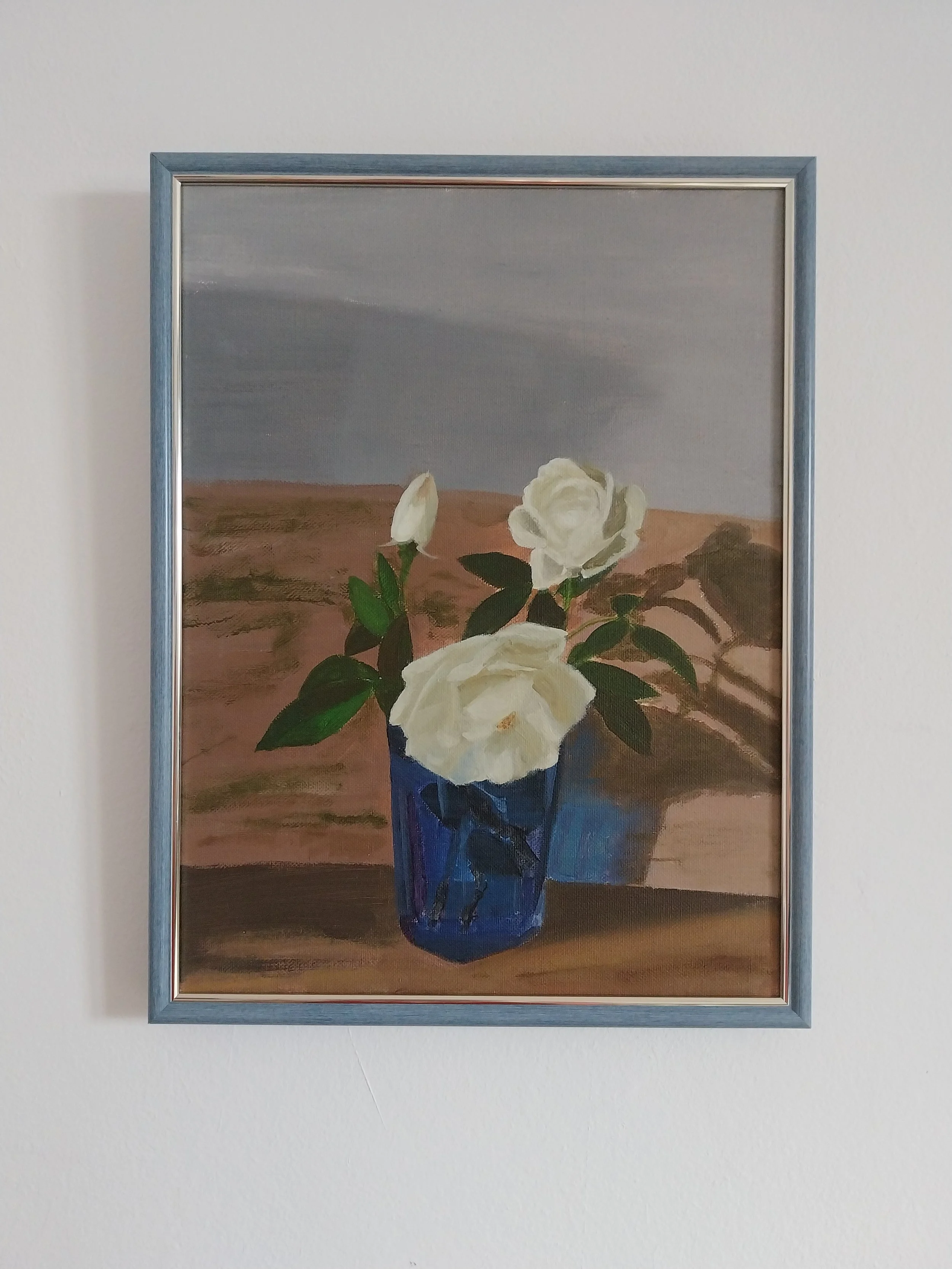 White roses on white wall.jpg