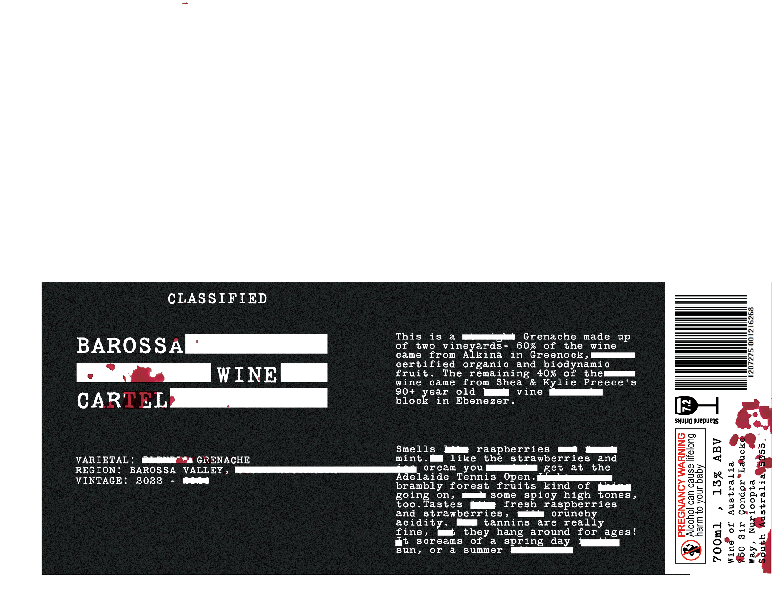 Black wine label with white text and rectangles, with red splattered on the label.
