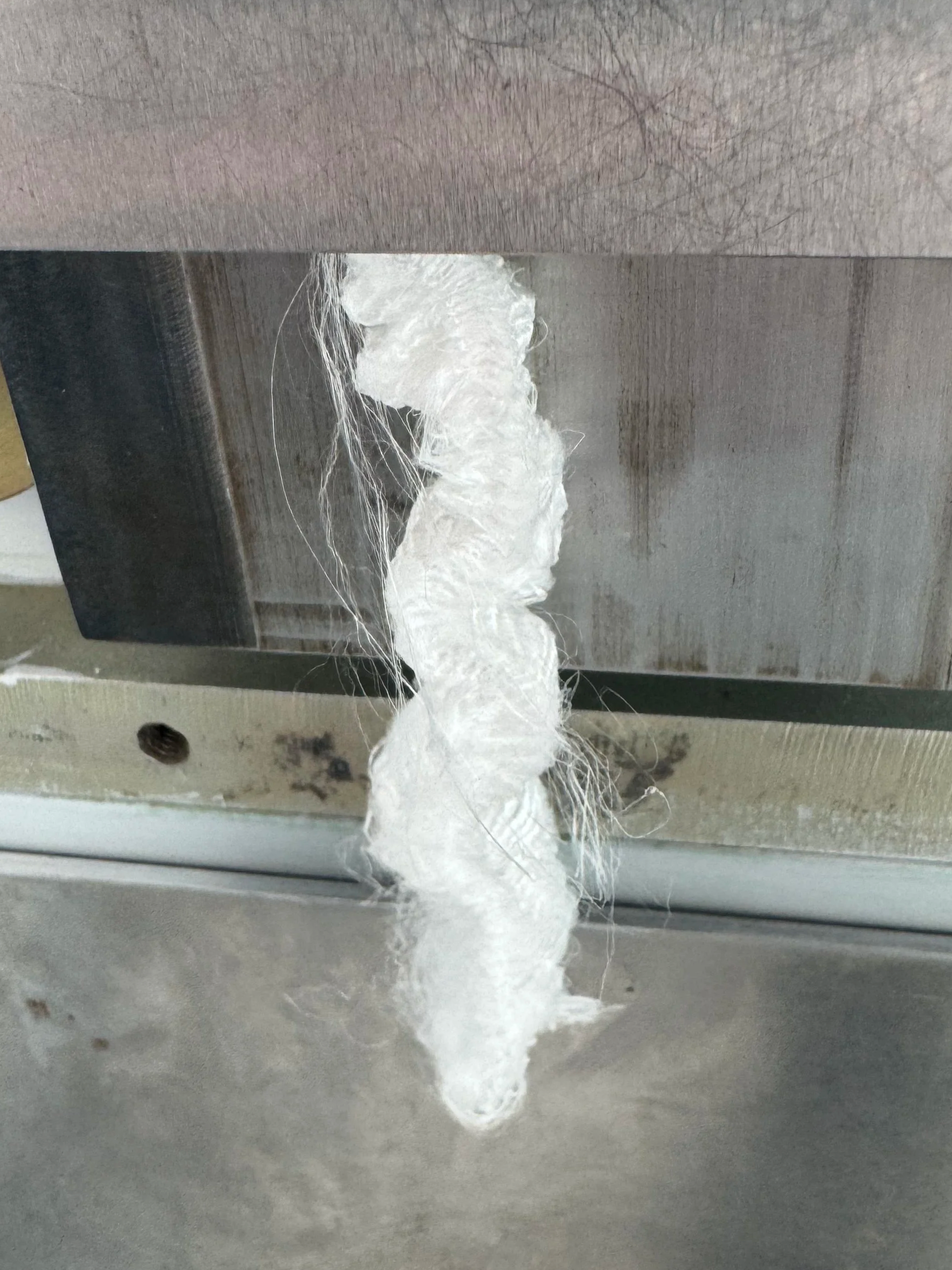 Crimped tow exiting stuffer box