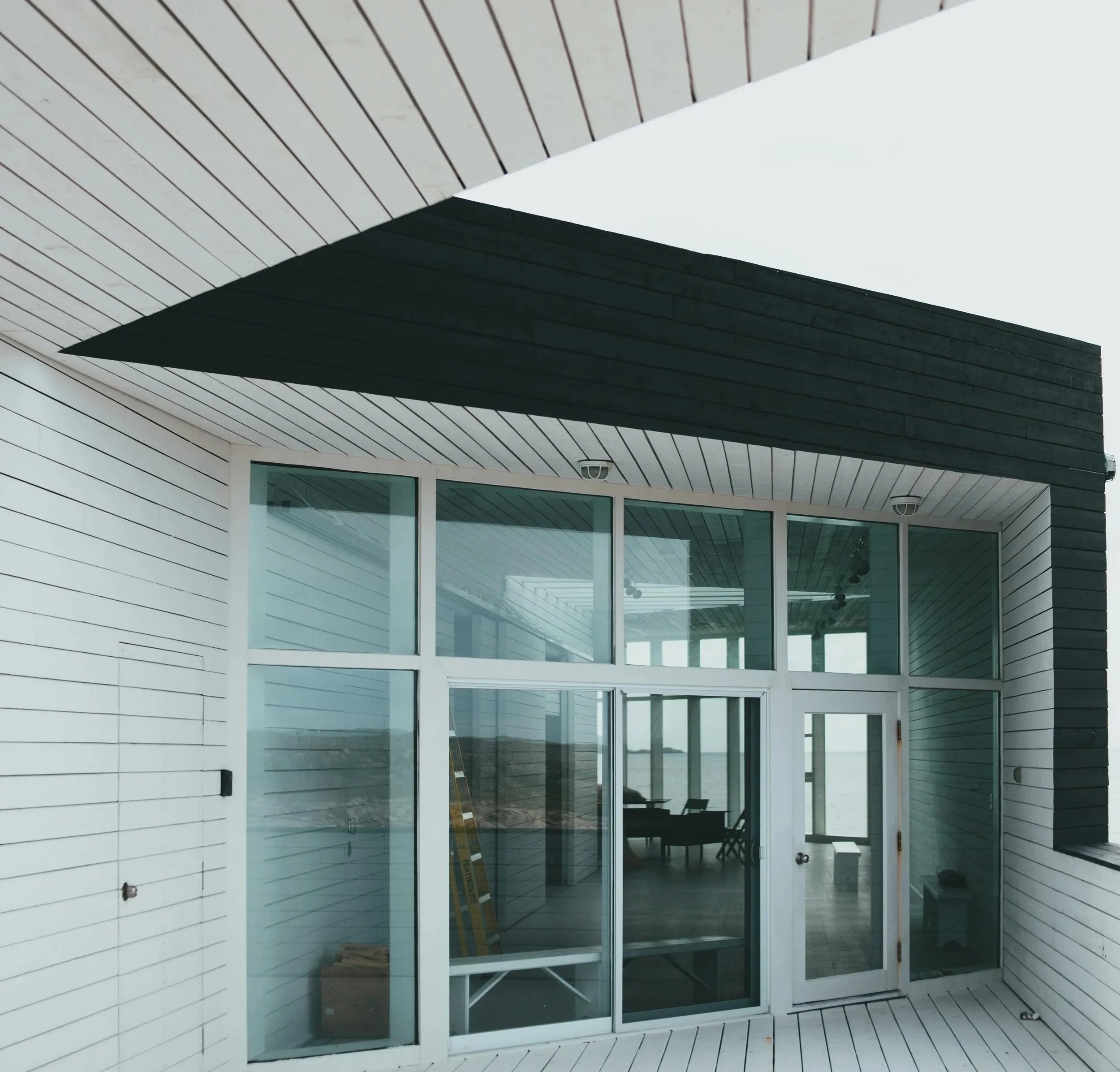 Oranssi technician working on a roof project