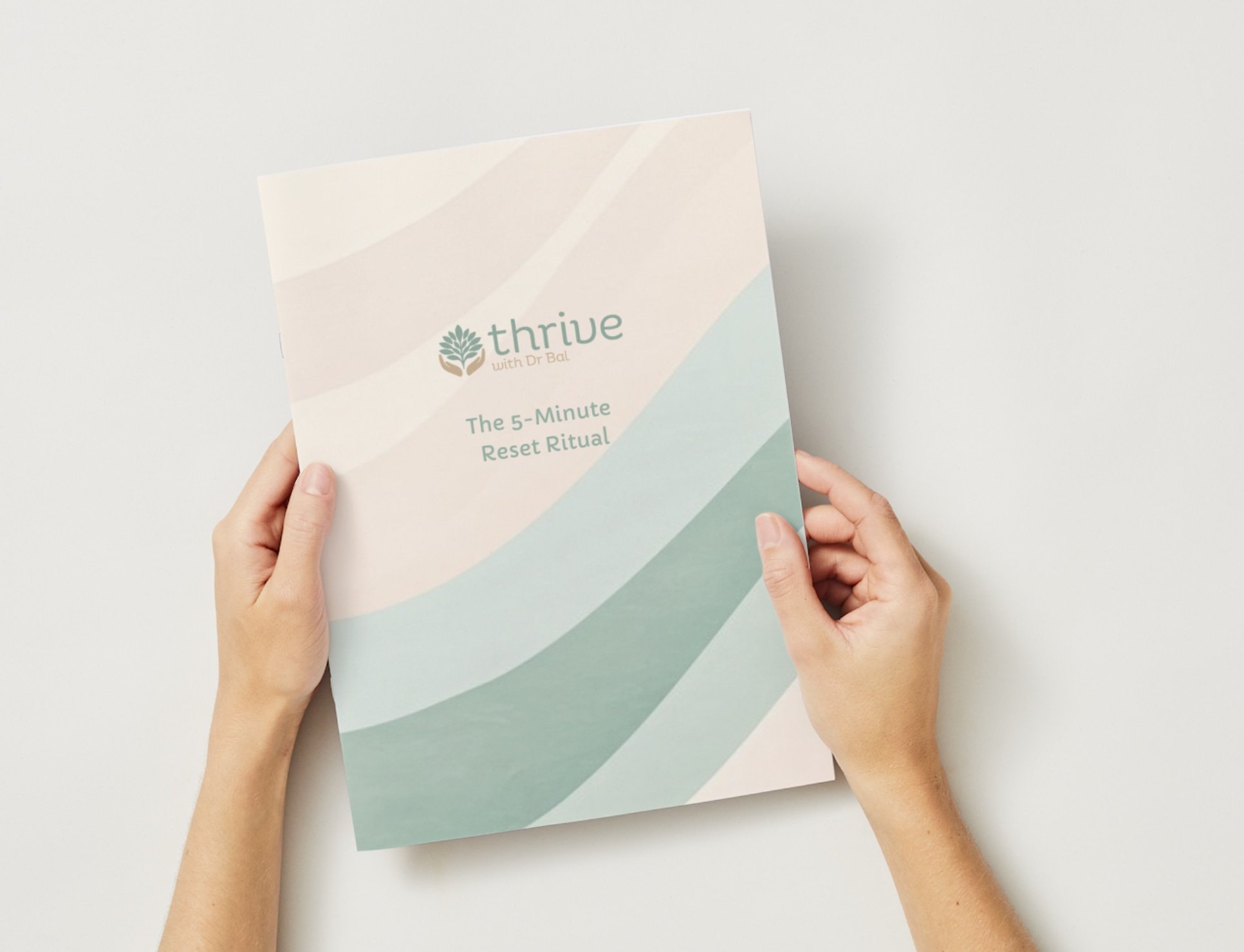 Hands holding a guide titled "The 5-Minute Reset Ritual" featuring the Thrive with Dr Bal logo and a soft pastel wave design.