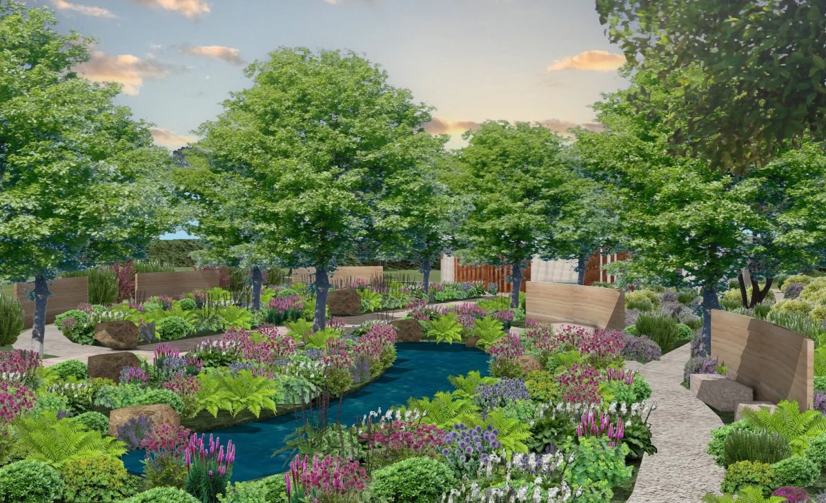 A landscaped garden with a small winding stream, lush green trees, colorful flowers, and stone benches along paved walkways.