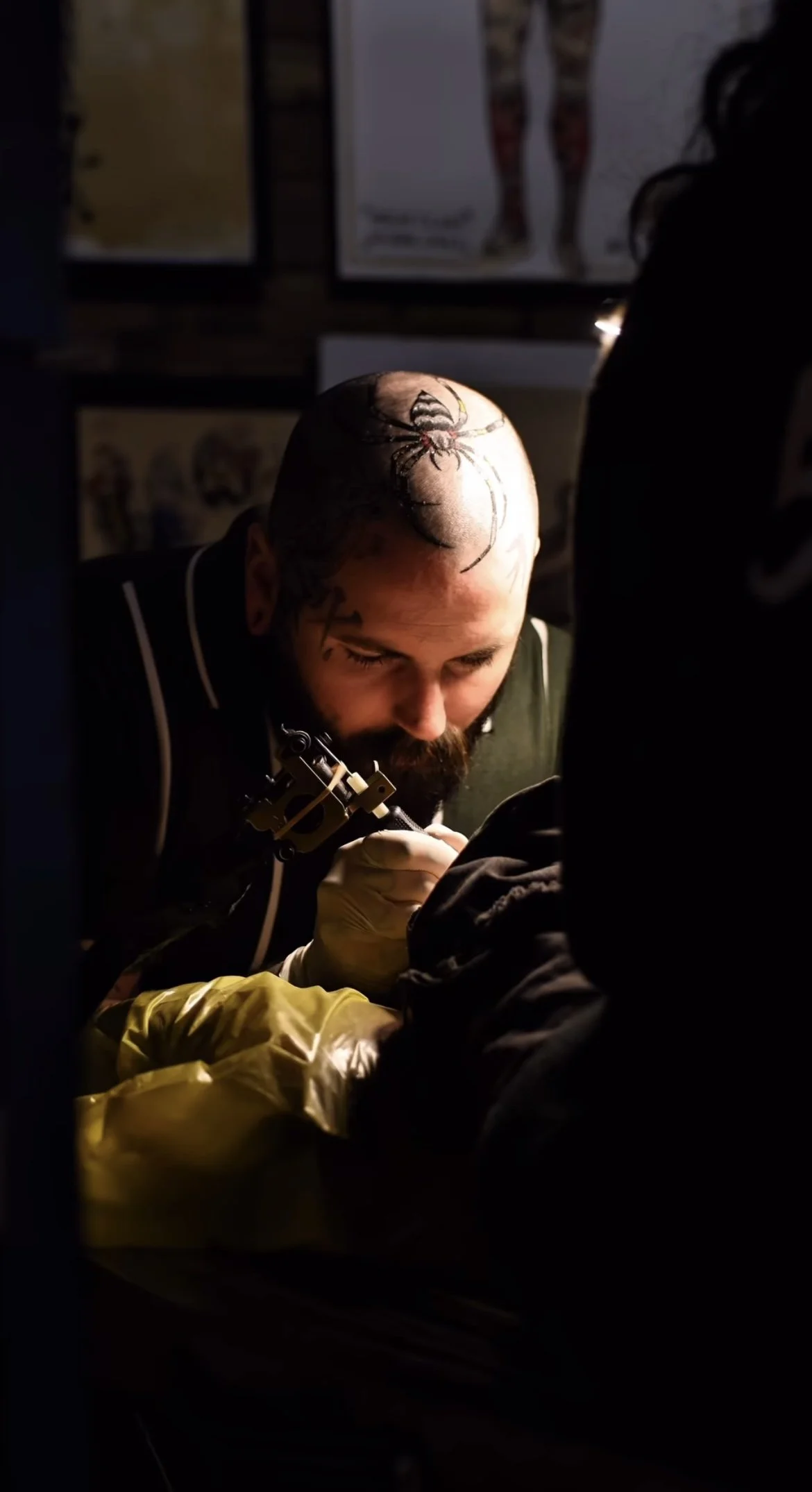 A tattoo artist in liverpool tattooing a tradional tattoo design 