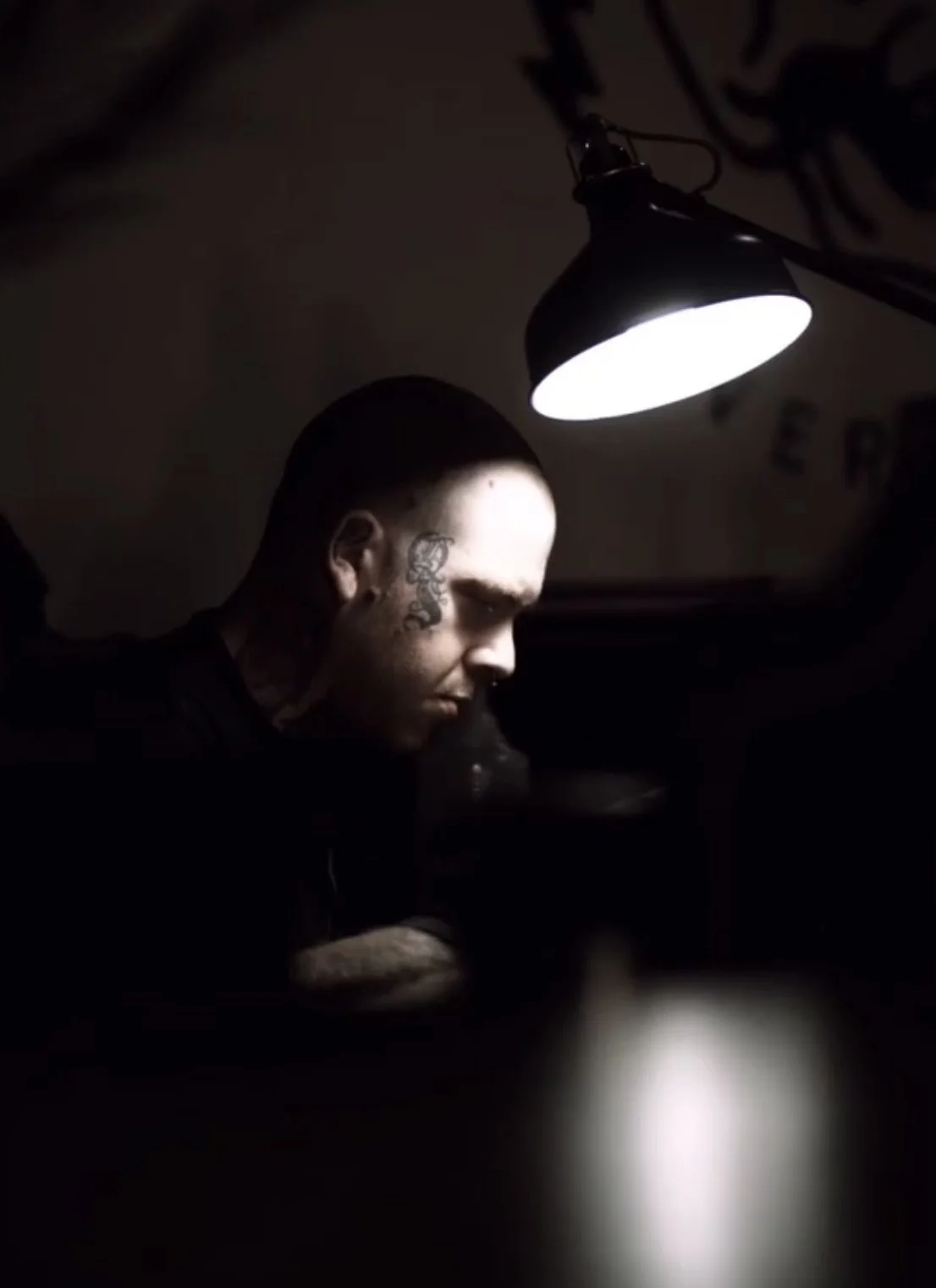 male tattoo artist tattooing a realistic portrait in liverpool city centre studio